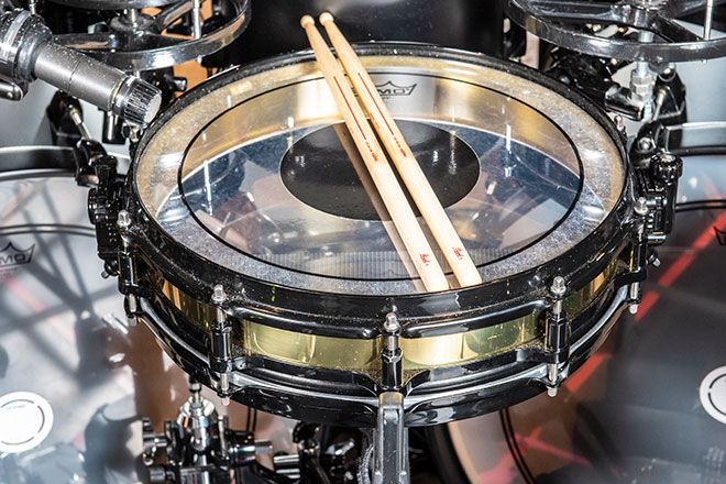 Yukihiro deals drum set